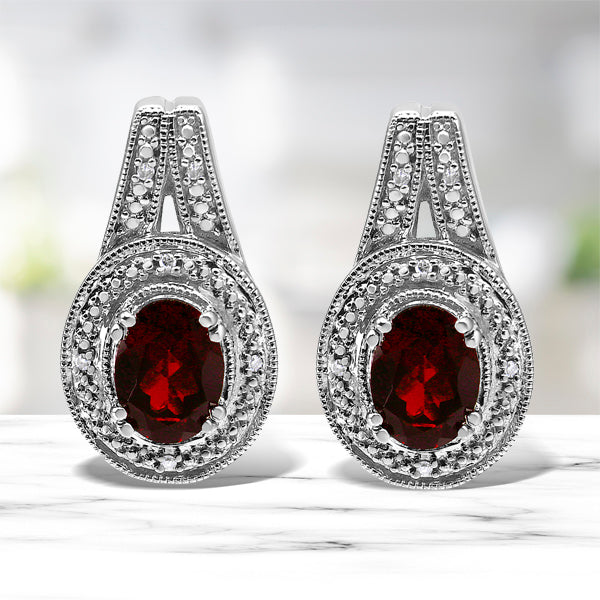 .925 Sterling Silver Diamond Accent and 8x6mm Red Oval Garnet Stud Earrings I-J Color, I1-I2 Clarity on sale at MyriadMart