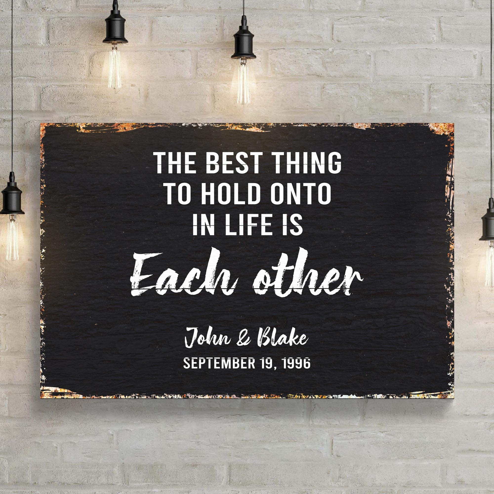 The Best Thing To Hold Onto Life Is Each Other Sign on sale at MyriadMart