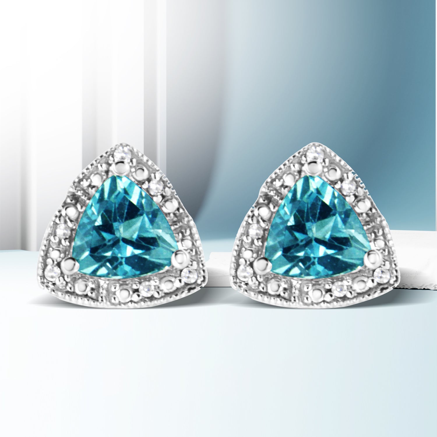 .925 Sterling Silver 6x6 mm Trillion Cut Blue Topaz Gemstone and Diamond Accent Stud Earring I-J Color, I1-I2 Clarity on sale at MyriadMart