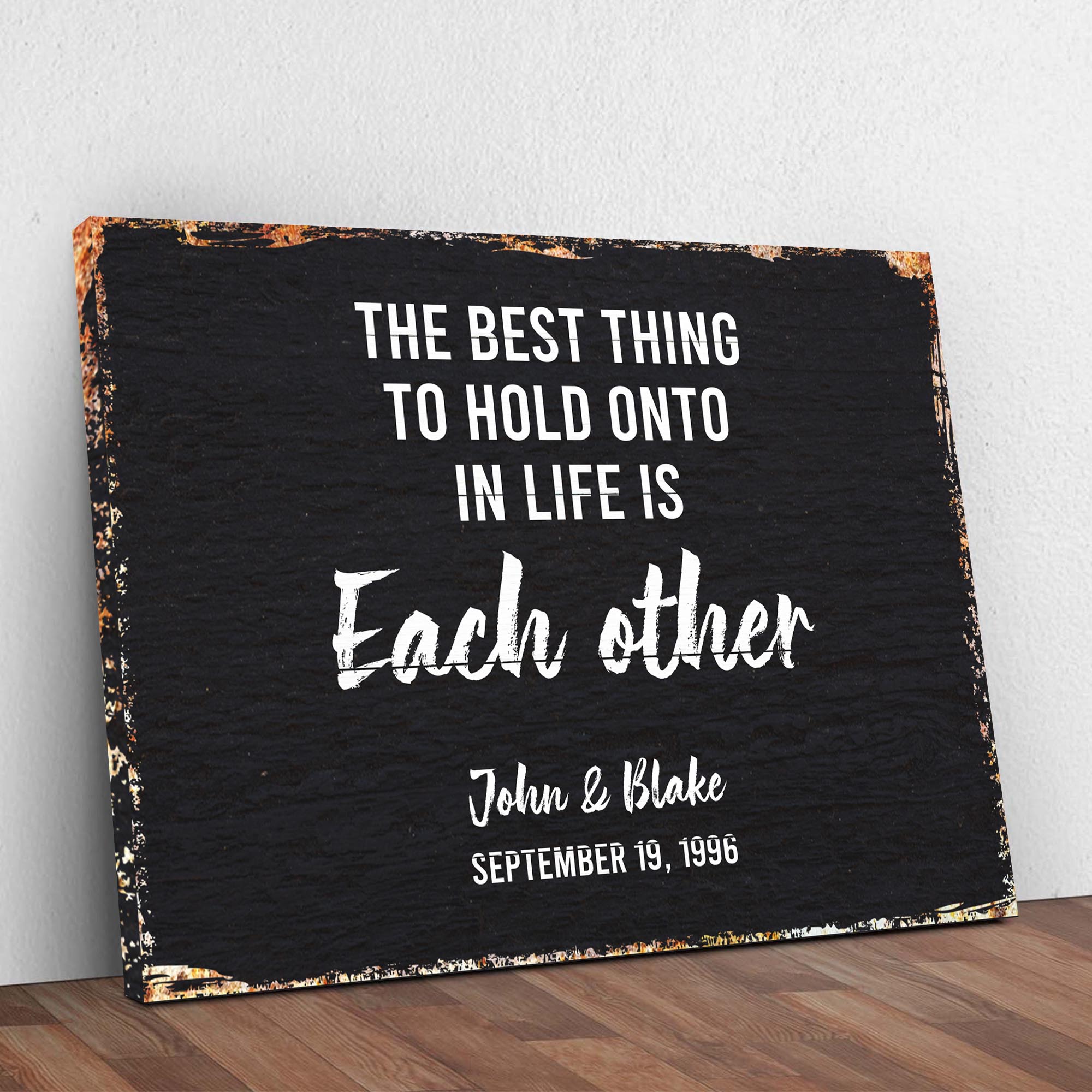 The Best Thing To Hold Onto Life Is Each Other Sign on sale at MyriadMart